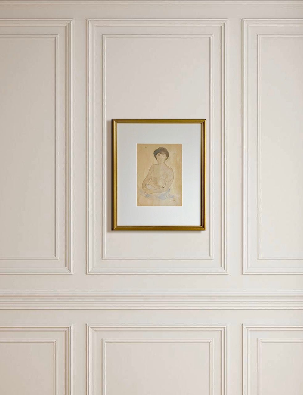 Framed watercolor nude figure artwork in gold frame on paneled wall