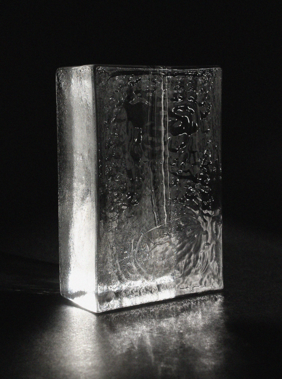 Textured ice glass block vase with carved interior detail view