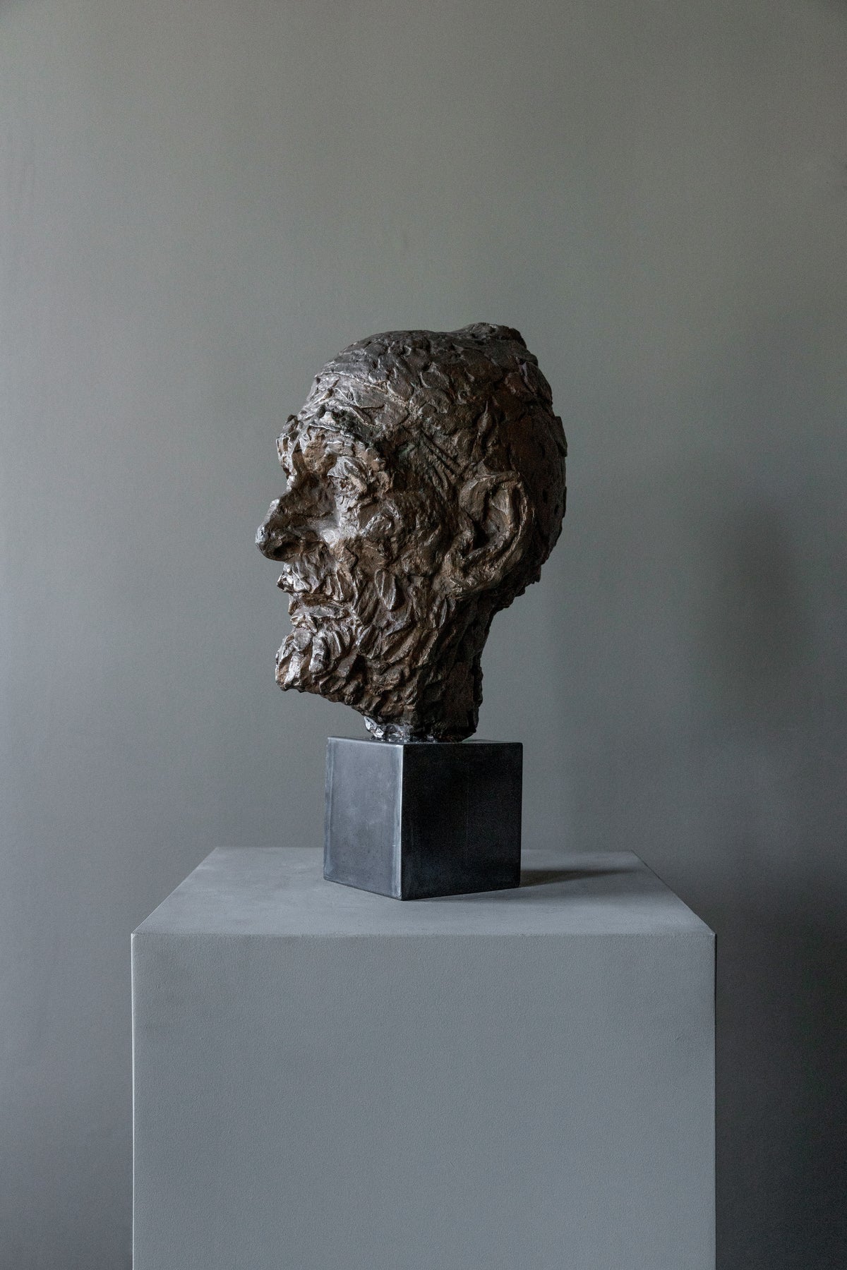 Vintage Bronze Sculpture 60s — side view on gray pedestal