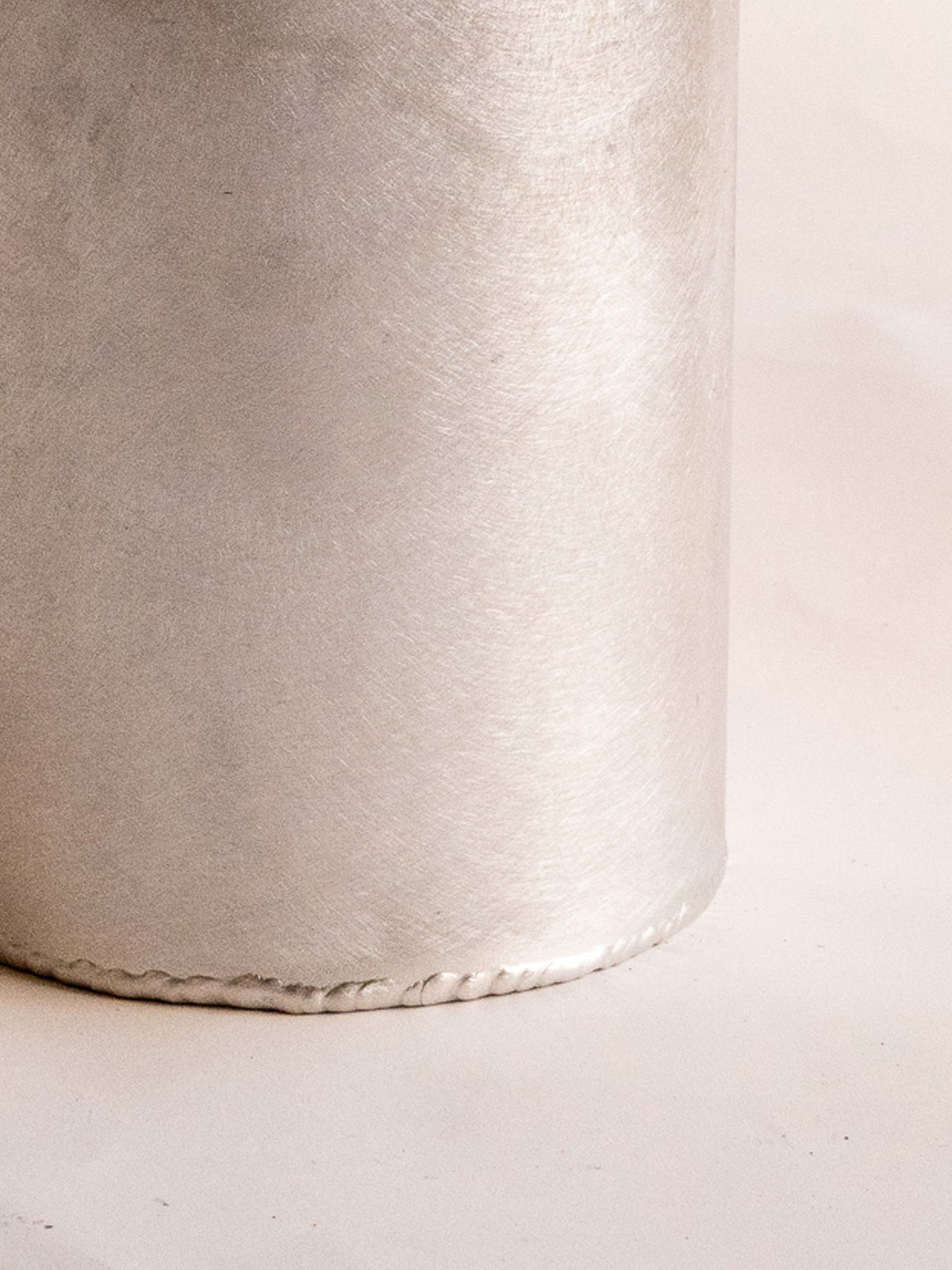 Contemporary beige woven desk bin with stitched edge detail