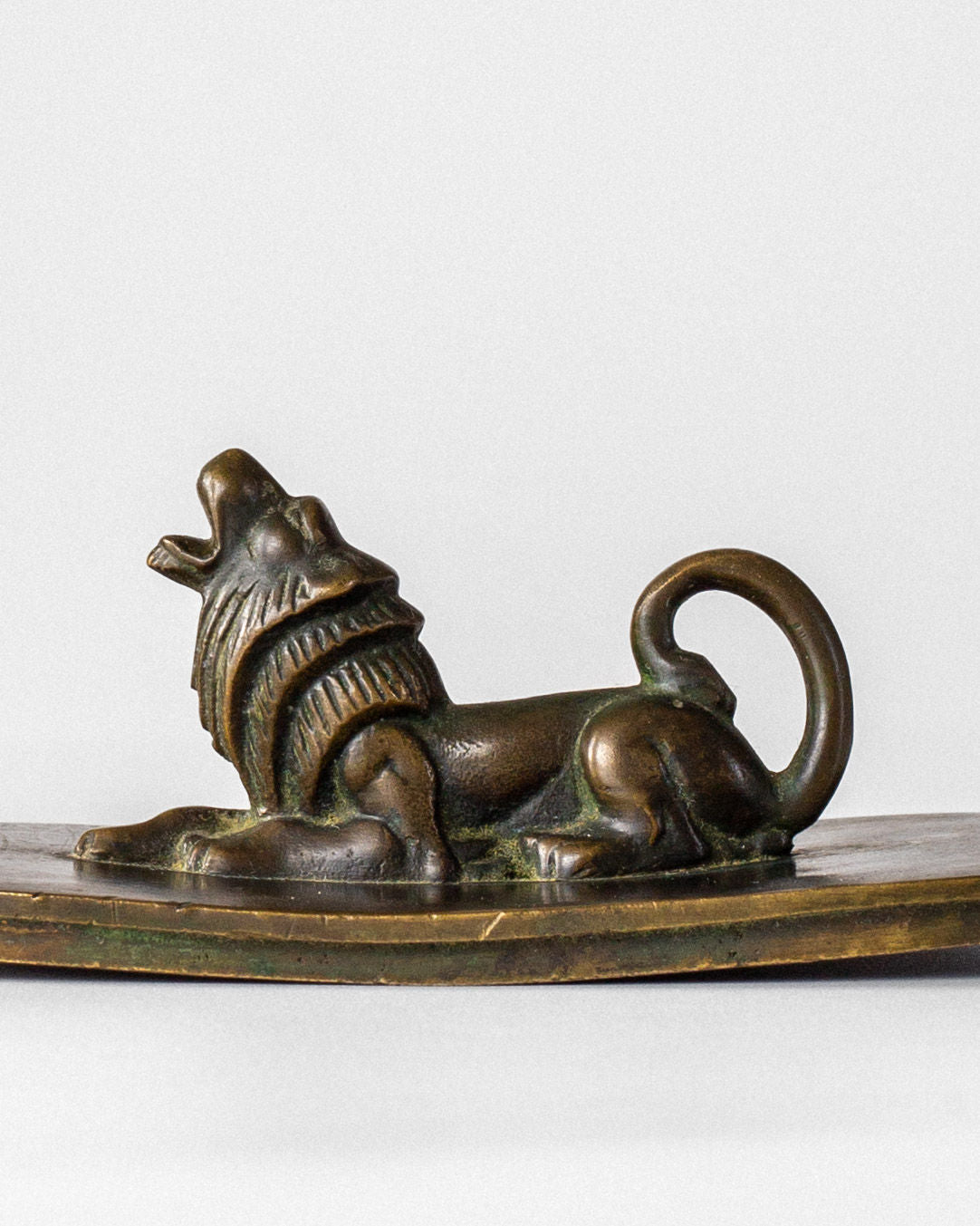 Bronze Art Deco lion sculpture detail on decorative box lid