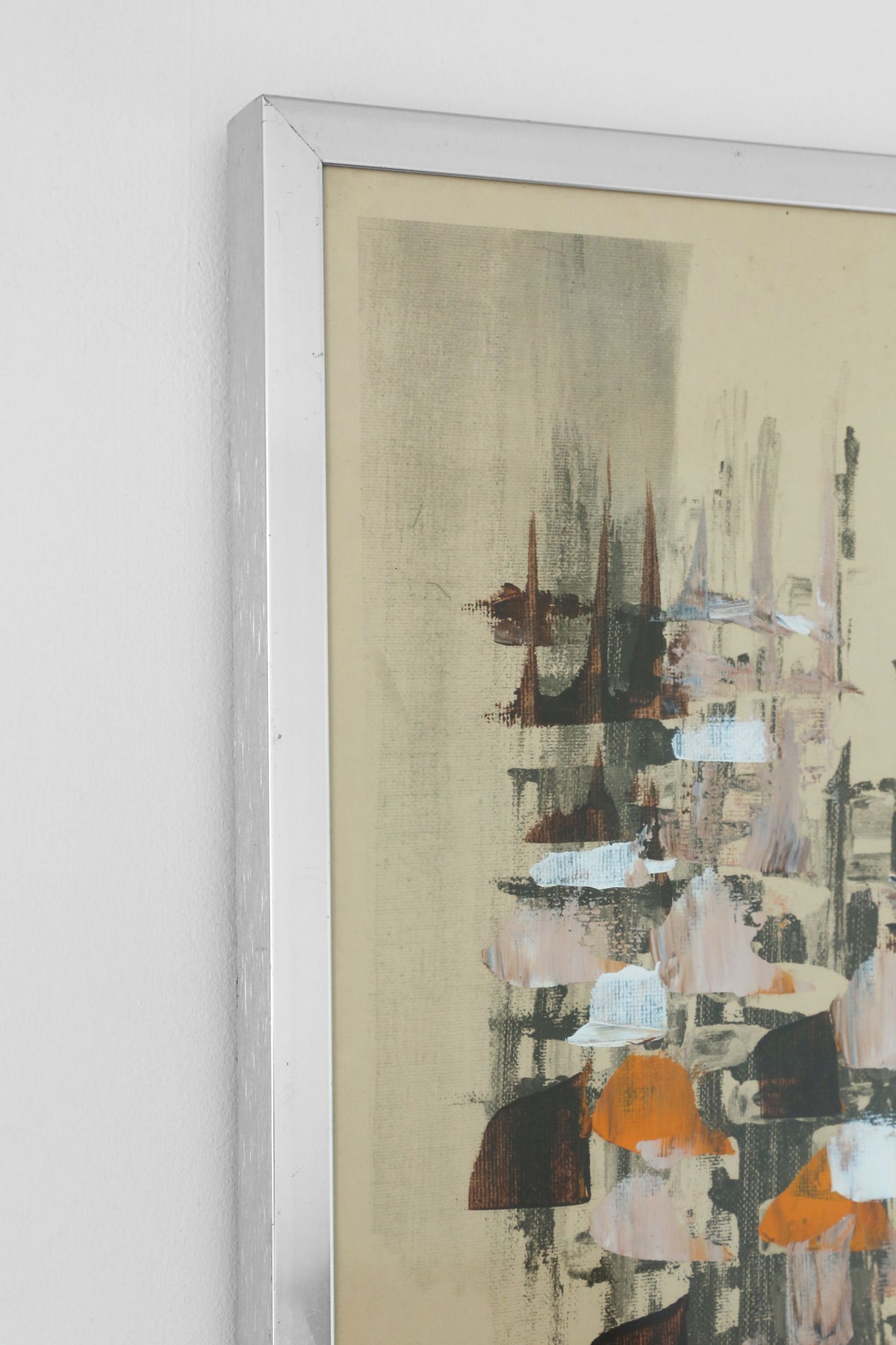 Abstract painting with orange, blue and dark tones in white frame