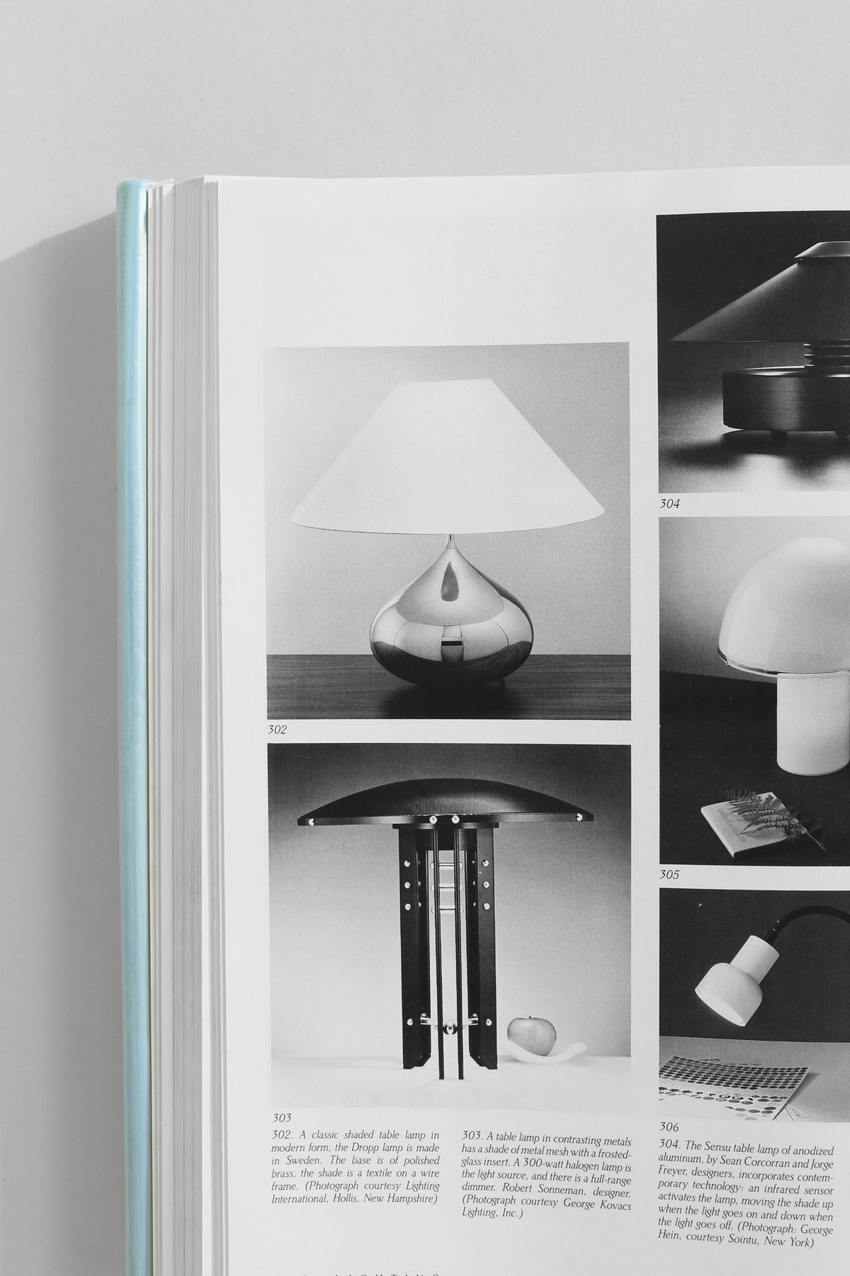 Interior design book showcasing modern lamp collection and lighting fixtures