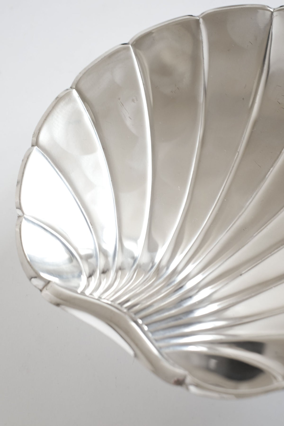 Close-up detail of silverplated shell dish showing ridged segments
