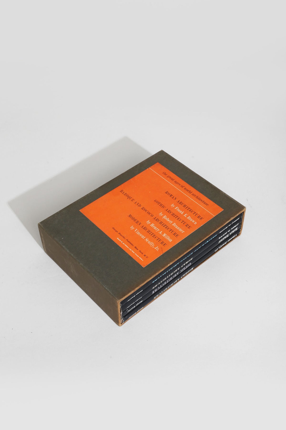 Architecture book box set with orange label on olive green cover