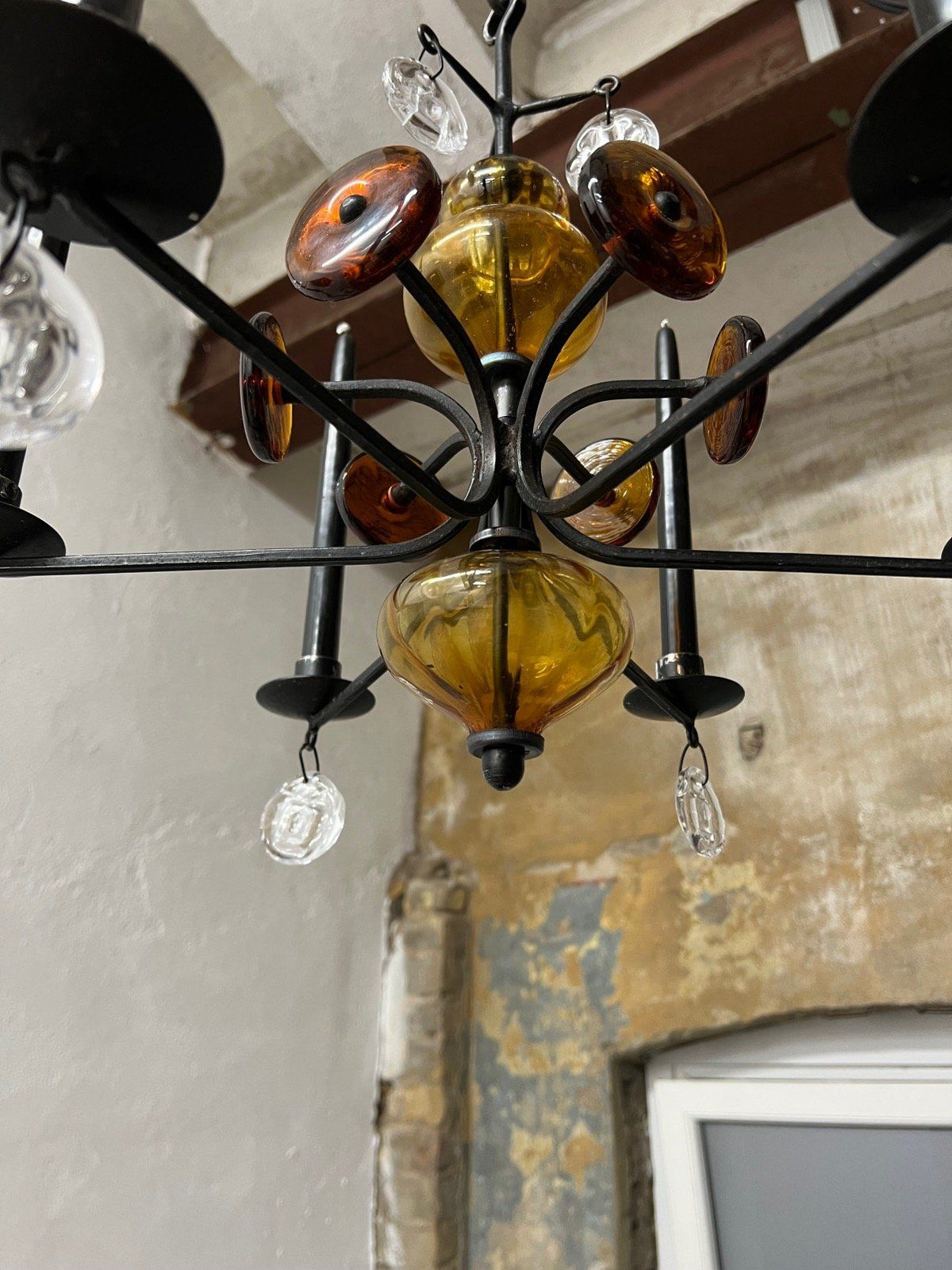 Amber glass chandelier with wrought iron frame detail view