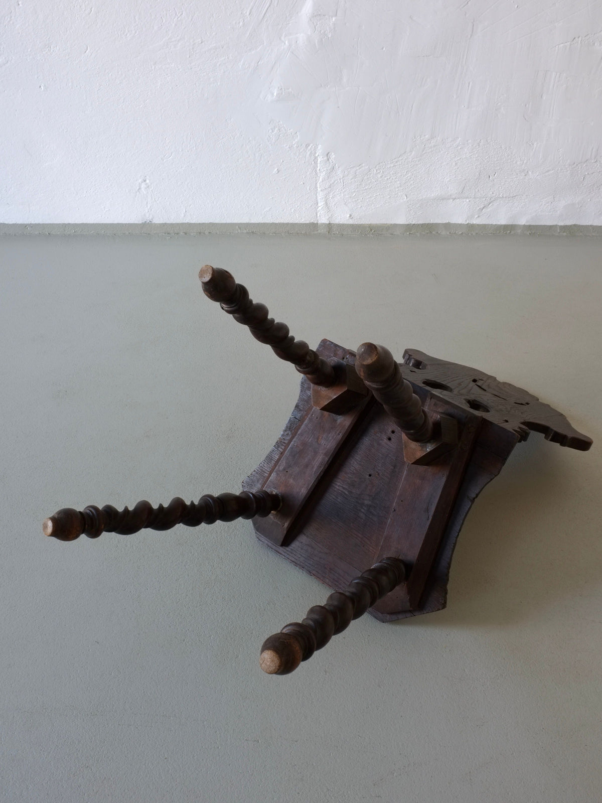 Twisted spindle detail of hand-carved dark oak antique chair