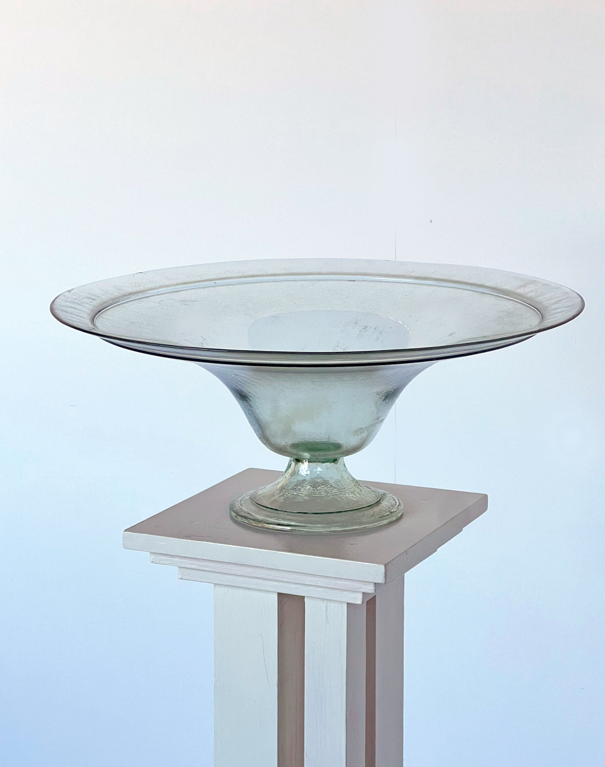 Clear glass compote bowl on pedestal base - detail view