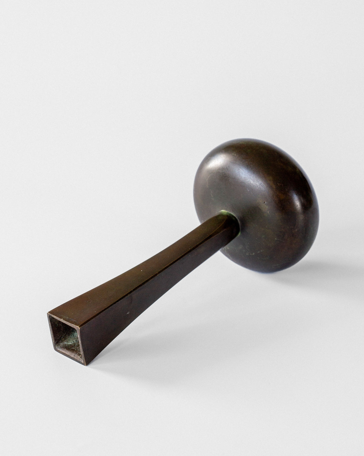 Art Deco bronze vase profile view showing spherical form and handle