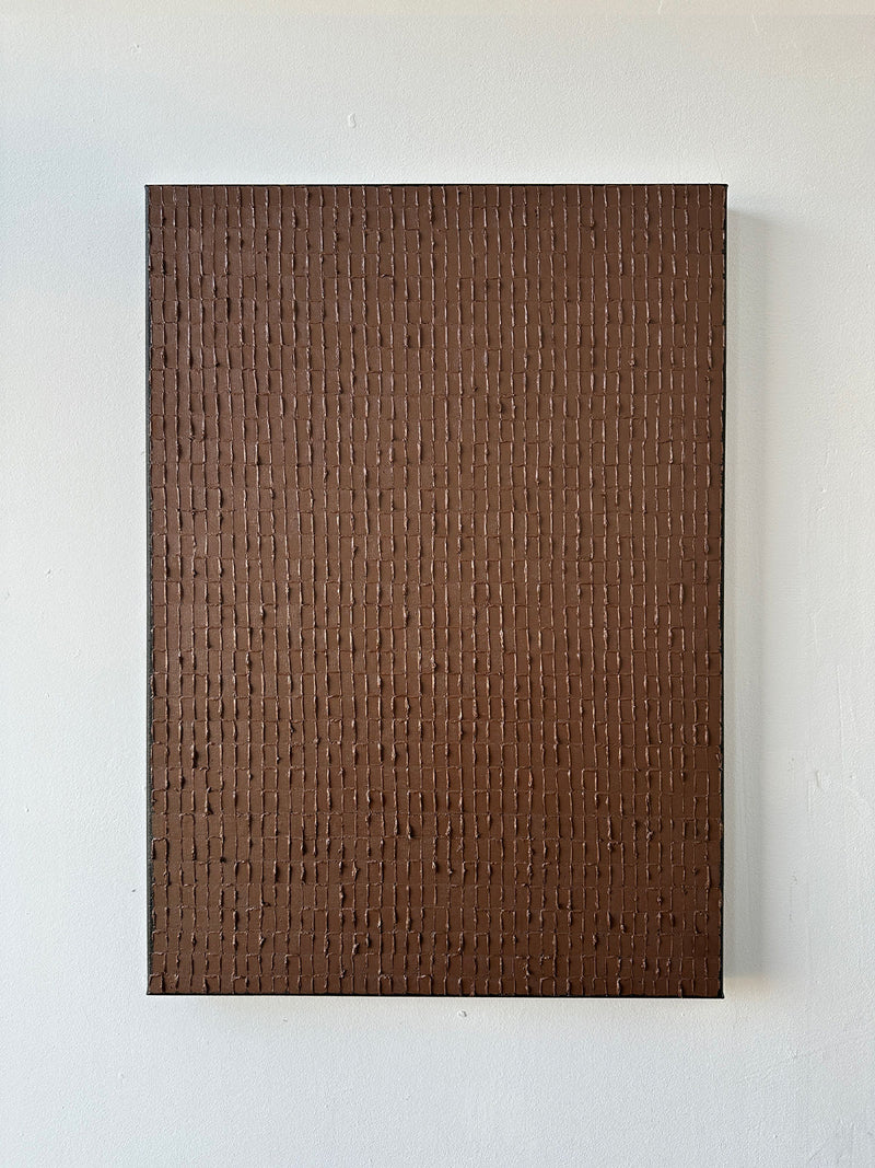'Light Umber' by Roi Elmaliah is a rectangular oil on canvas featuring a uniform brown color with vertical, textured lines forming a subtle grid. Reminiscent of Dutch art, it’s displayed against a plain white wall.