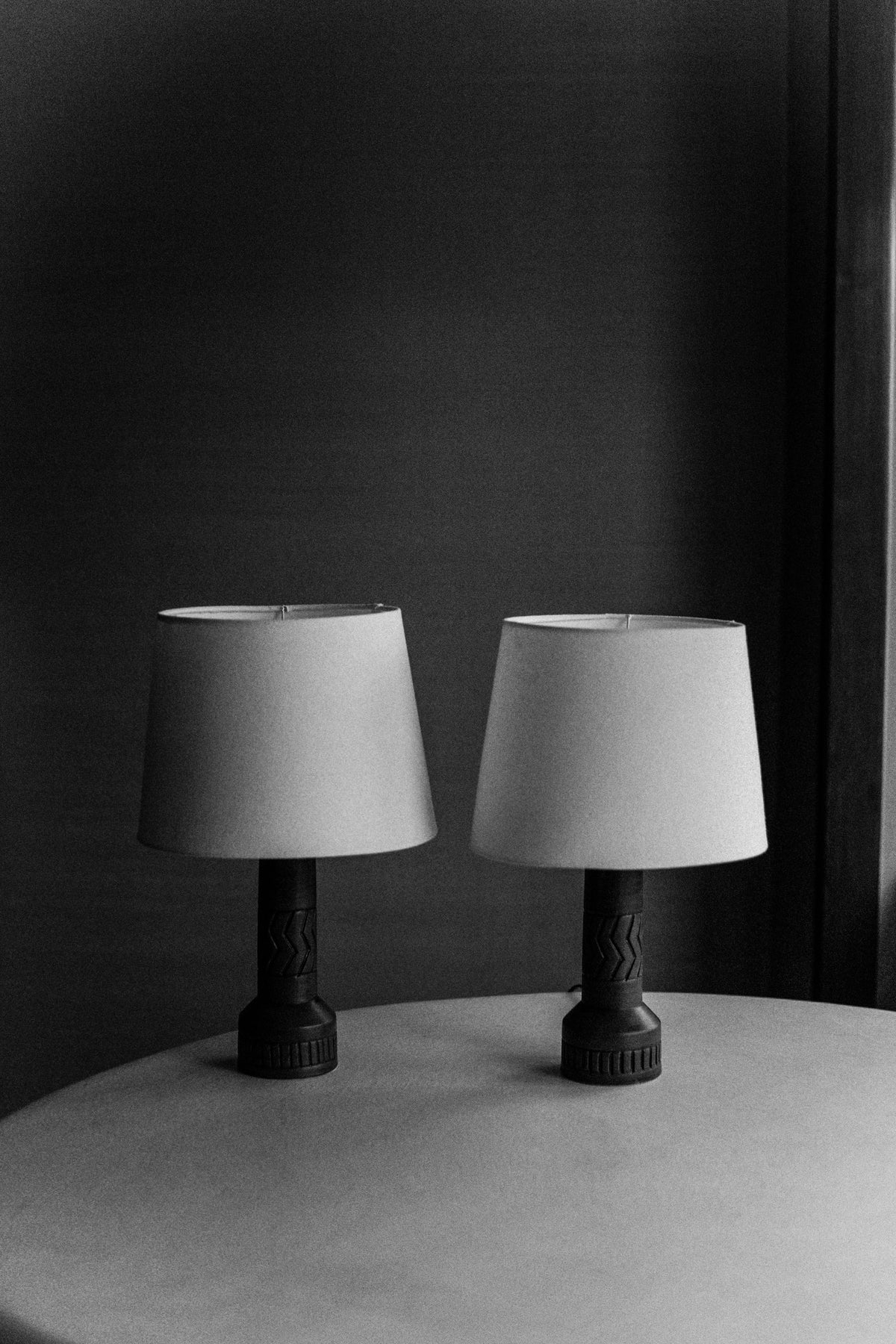 Beautiful vintage stoneware lamps with intricate designs and earthy tones