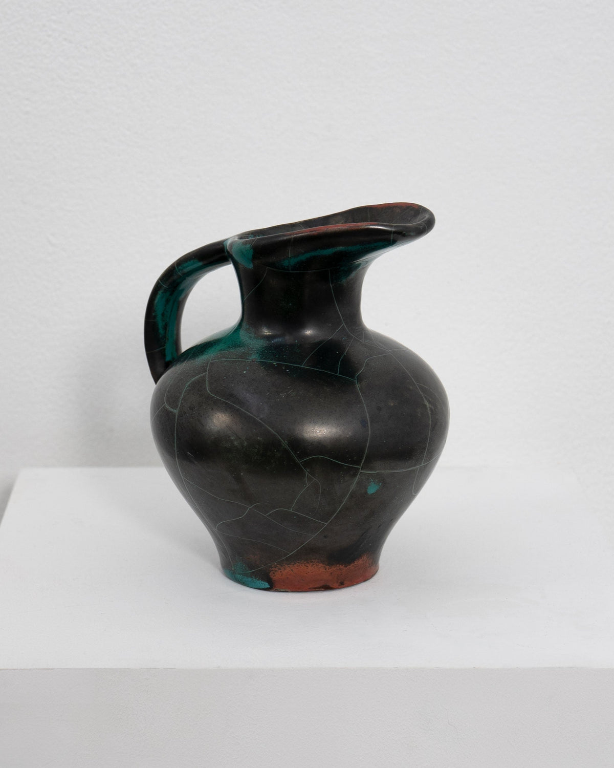 Dark ceramic jug with teal accents by Richard Uhlemeyer 1950s