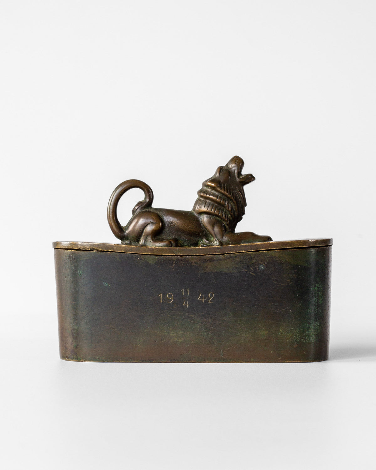 Art Deco bronze box with reclining lion finial, dated 1942