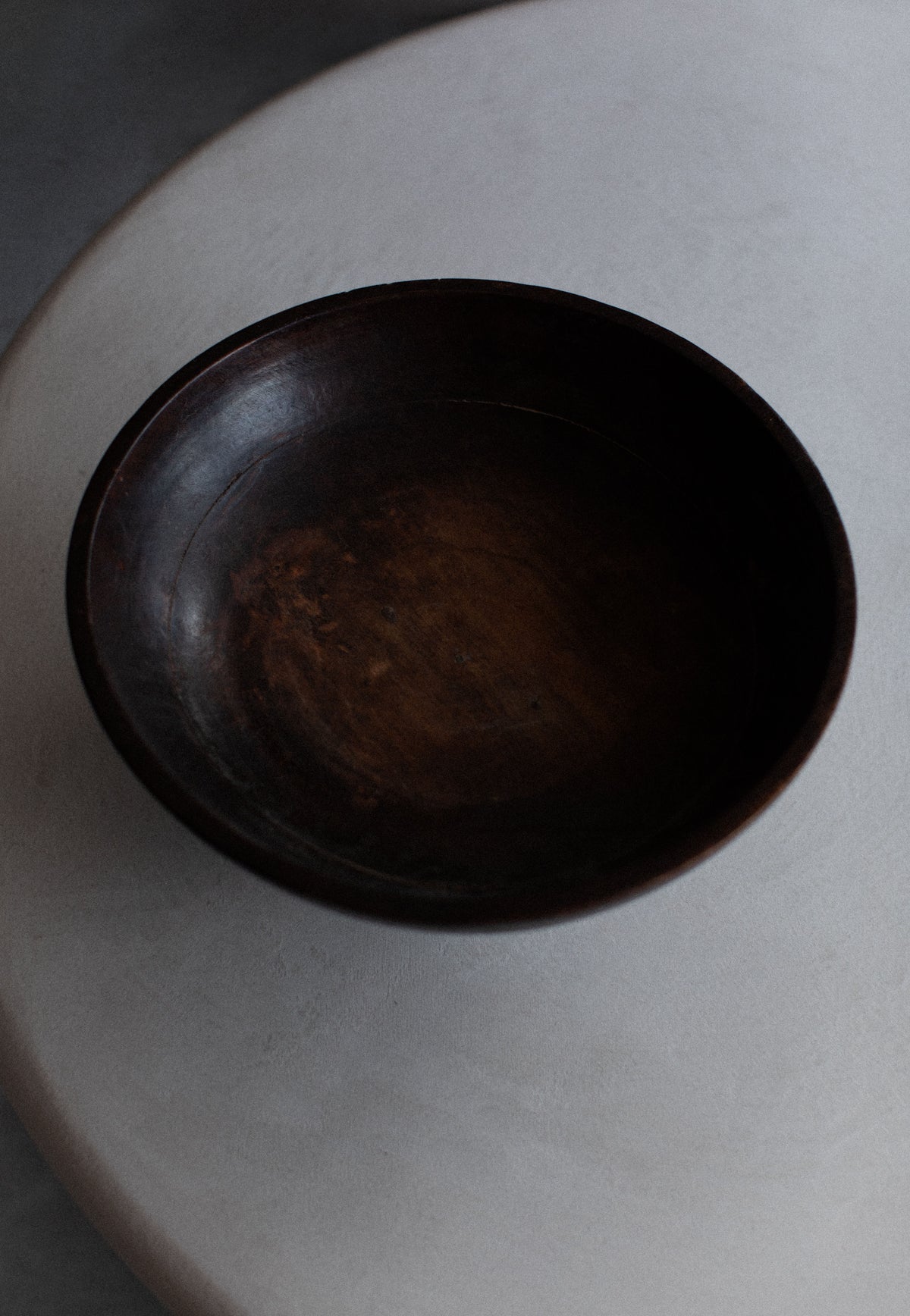  Rustic Japanese wooden bowl with a smooth, polished finish and elegant grain patterns