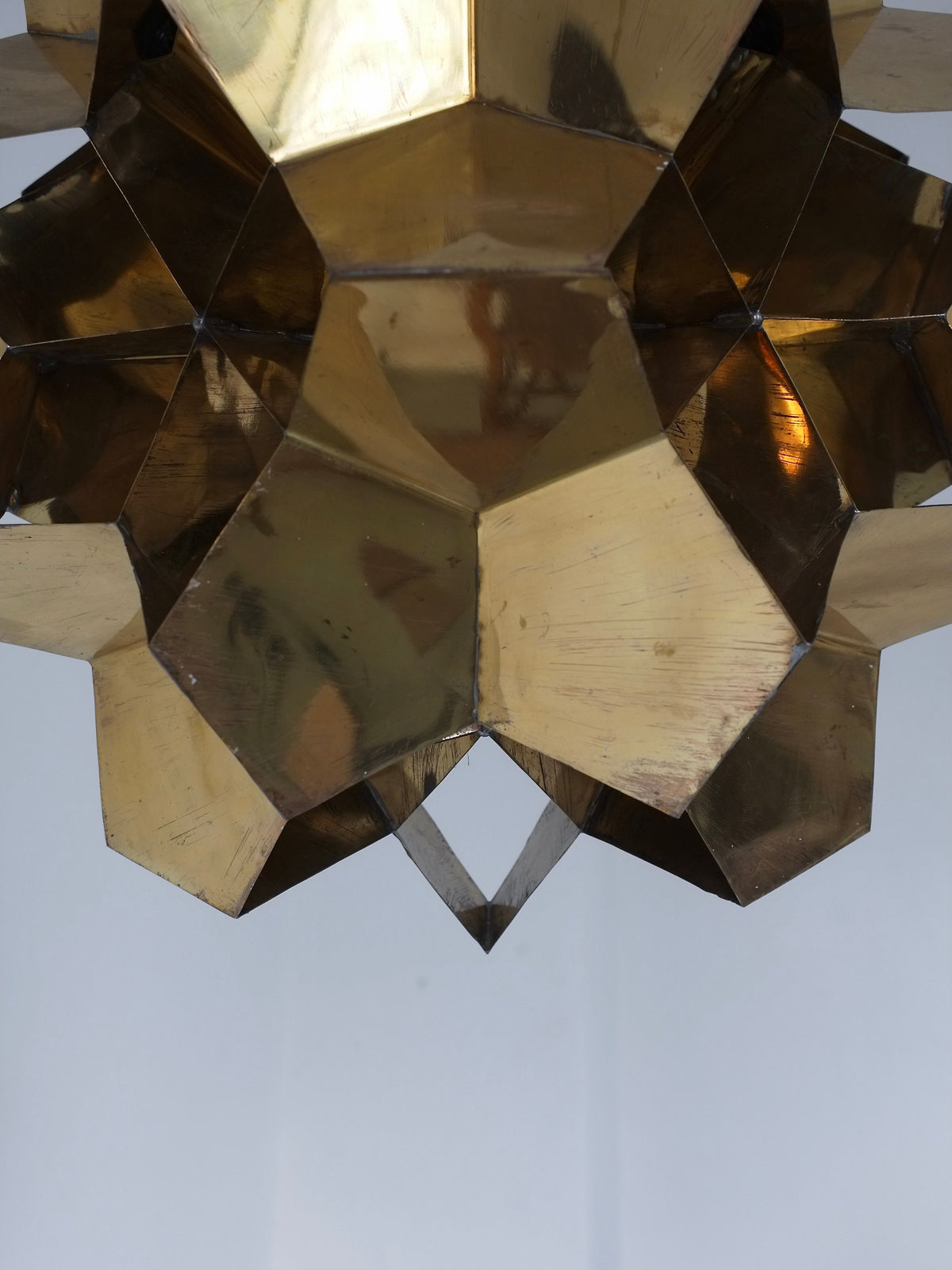 A close-up of the Veter Vintage Brutalist Brass Chandelier from Latvia, 1970s, showcases geometric metallic facets in solid brass, suspended against a plain white background—a striking example of sculptural lighting.
