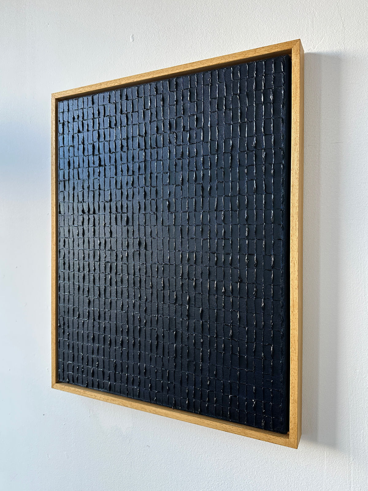 Textured navy blue geometric painting detail by Roi Elmaliah