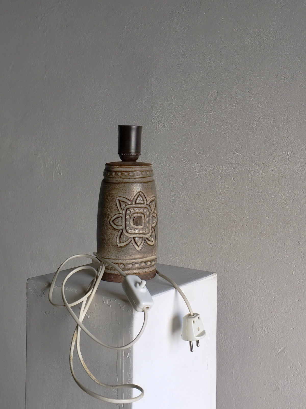Mid-century stoneware table lamp with floral motif and cord detail