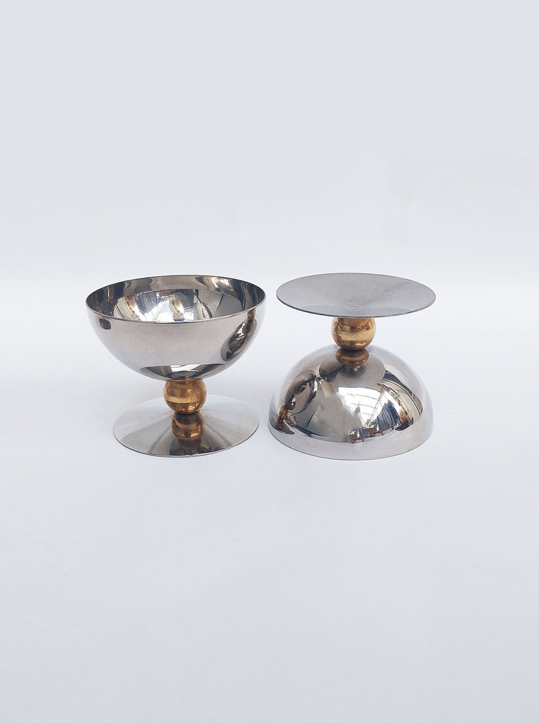 Four ceramic dessert cups with scalloped edges and matching spoons