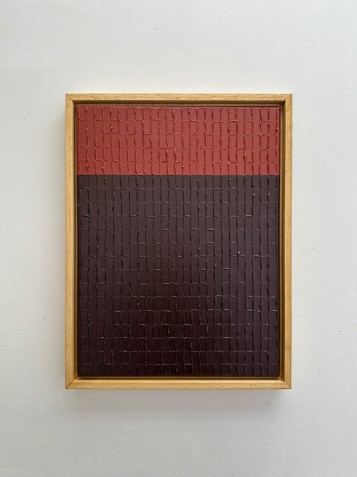 Textured Indian red mud painting with geometric grid pattern by Roi Elmaliah