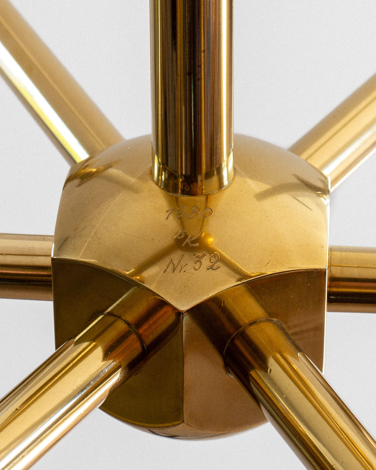 Close-up brass joint detail of 1980s monumental candle chandelier