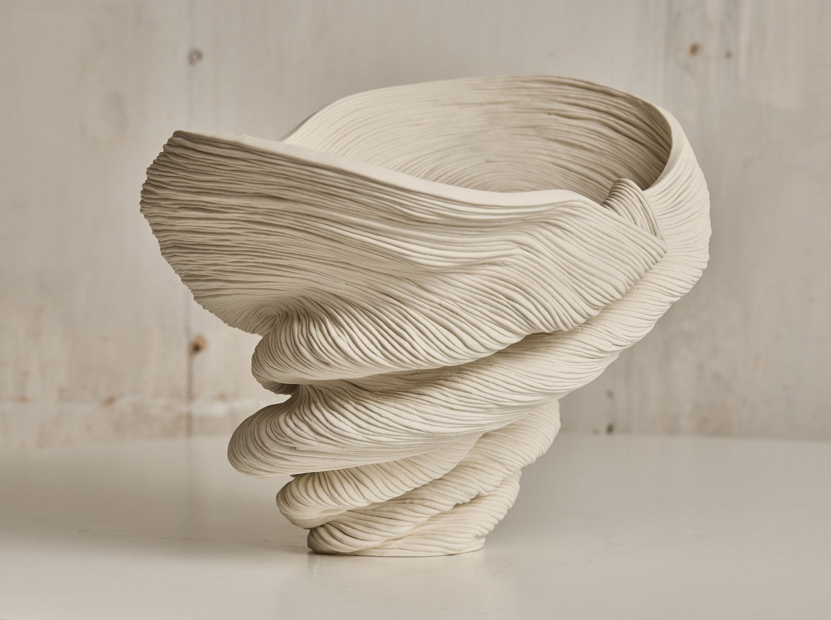 Sculptural Flutter vase with flowing ribbed ceramic layers in cream