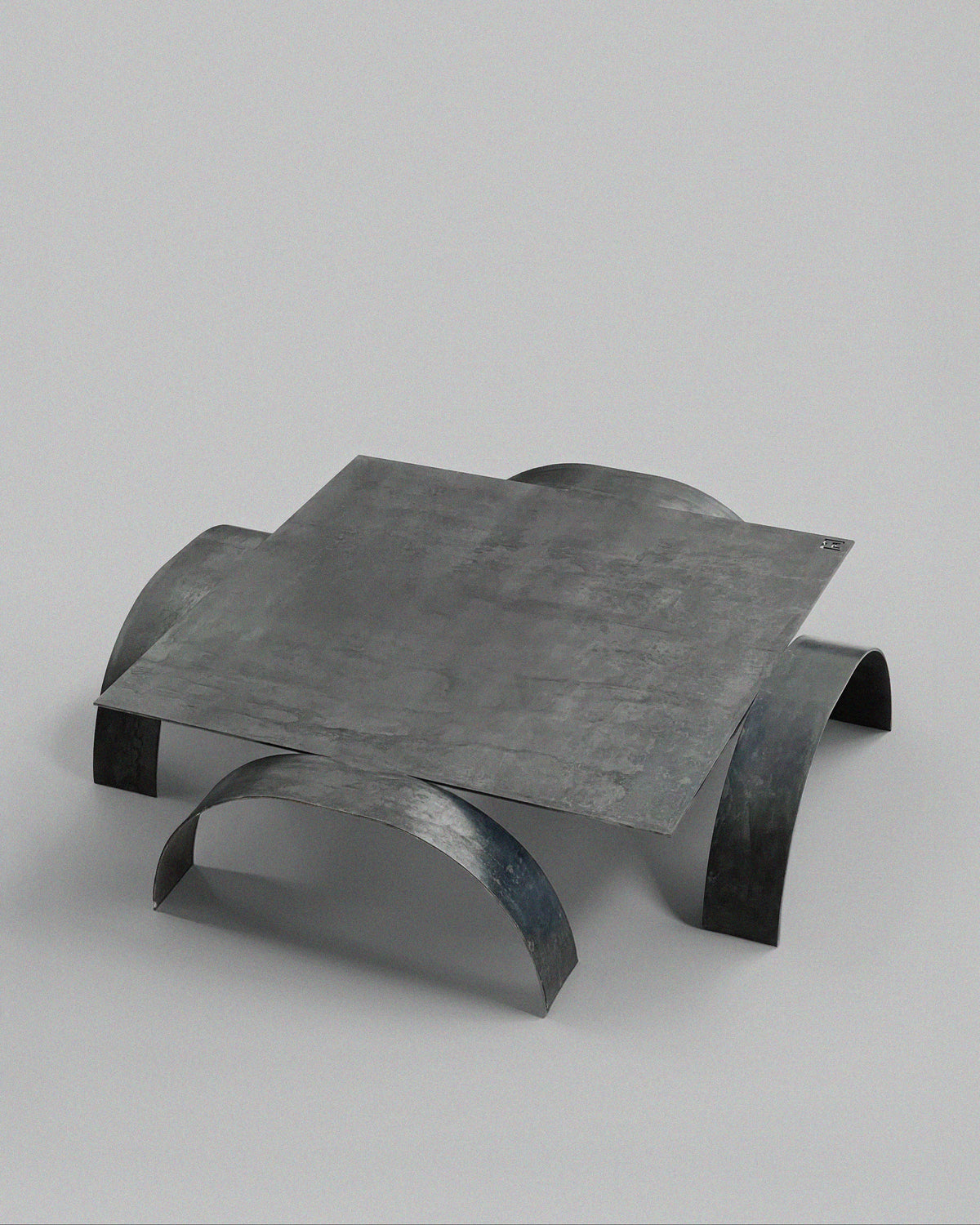 YUMI coffee table sculptural curved steel legs detail view
