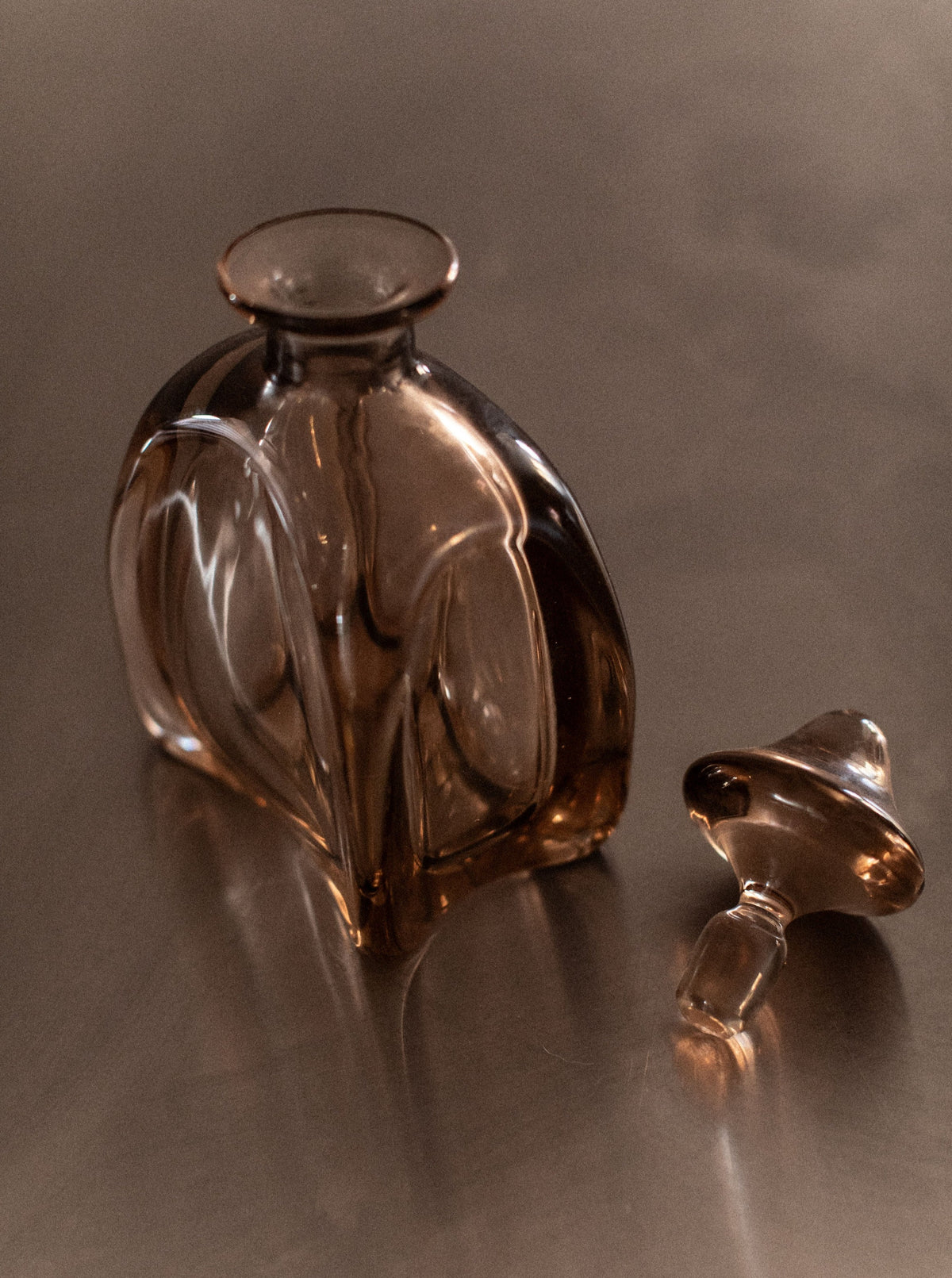 Vintage glass decanter with etched floral design and silver-plated base