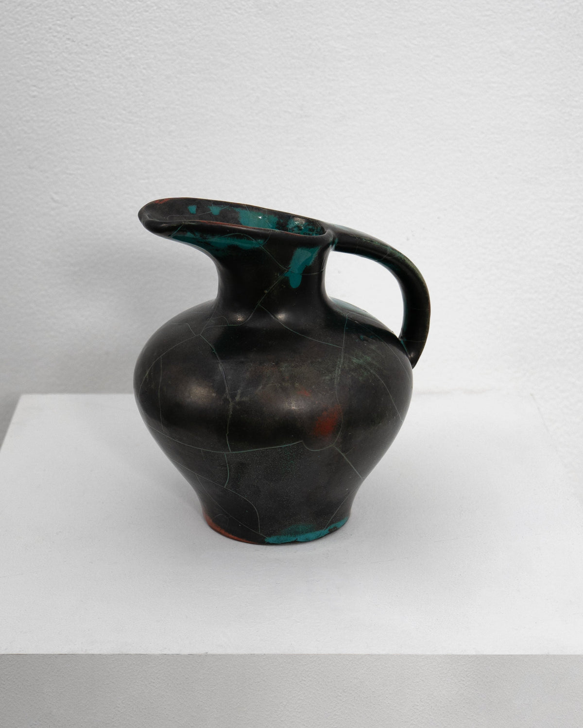 Dark ceramic jug with turquoise glazed interior by Uhlemeyer 1950s