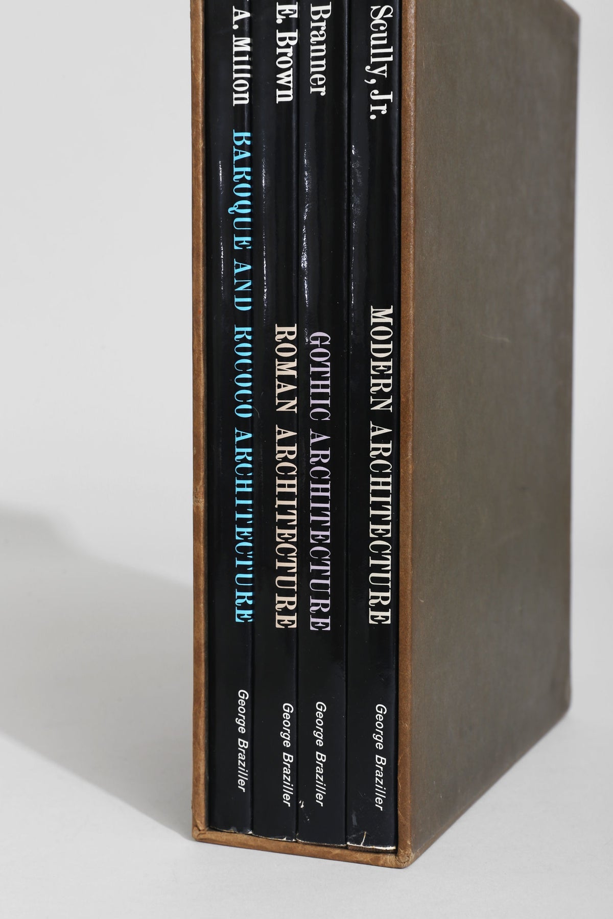 Spines of four black architecture books by George Braziller in box set