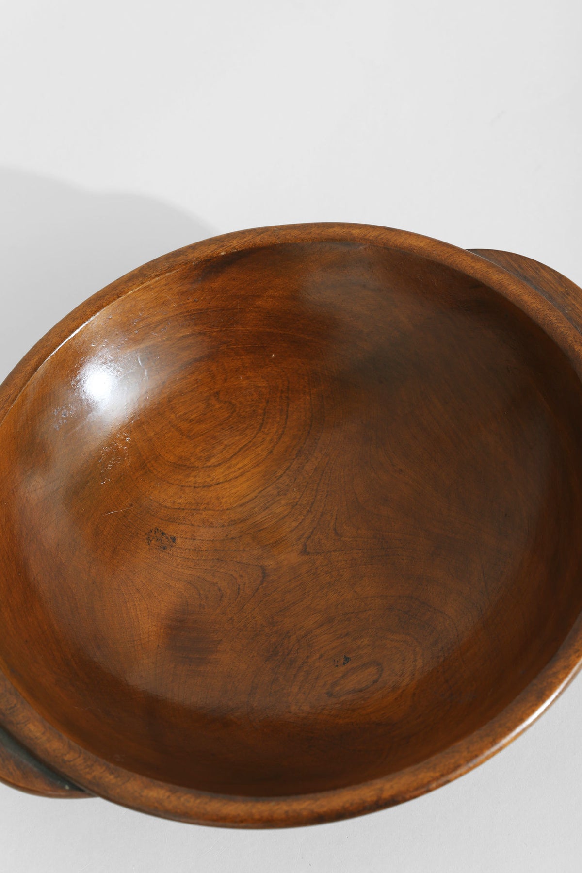 Interior view of handcrafted wooden bowl showing rich wood grain