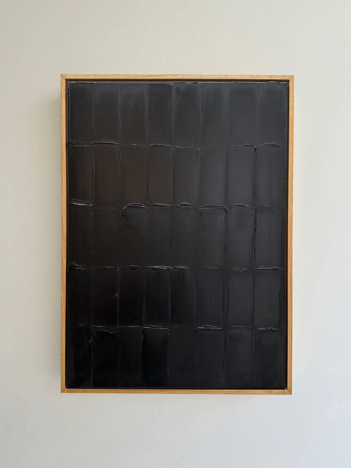 Abstract black textured painting with grid pattern by Roi Elmaliah