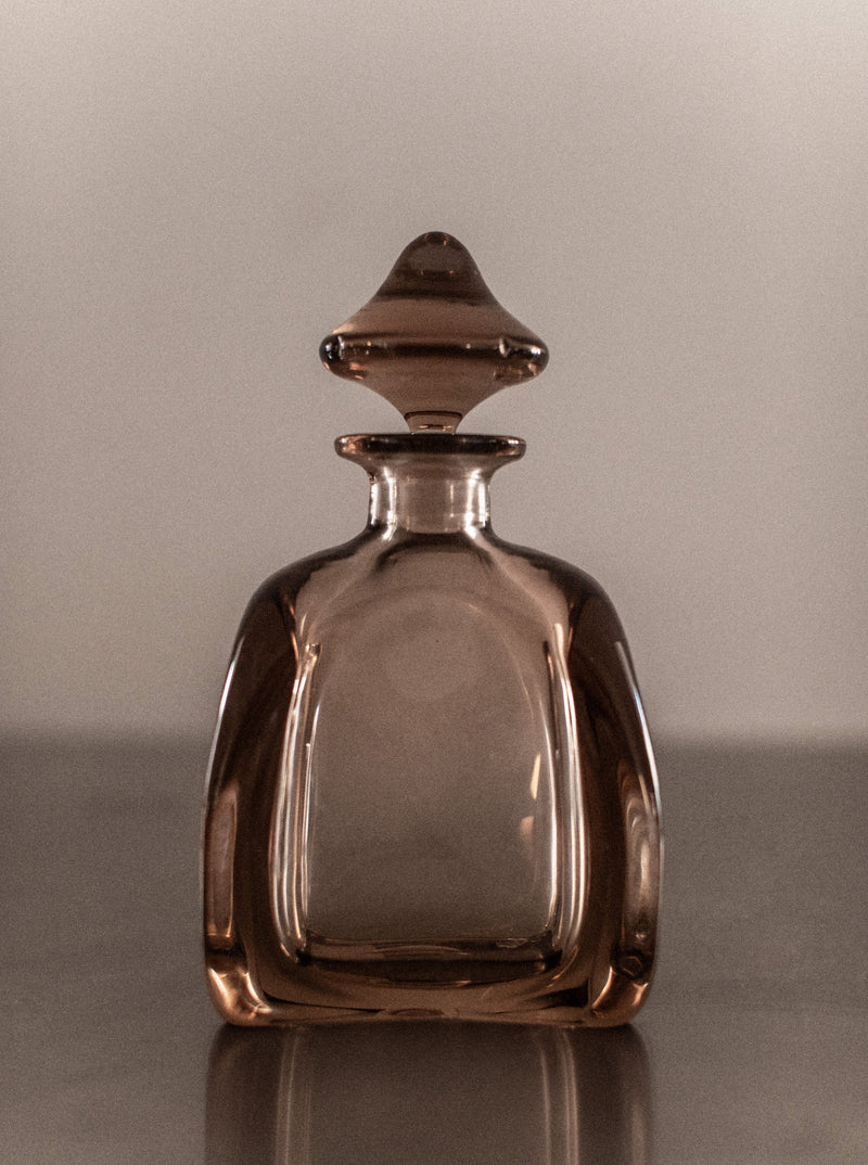 Antique crystal glass decanter with intricate diamond pattern and stopper