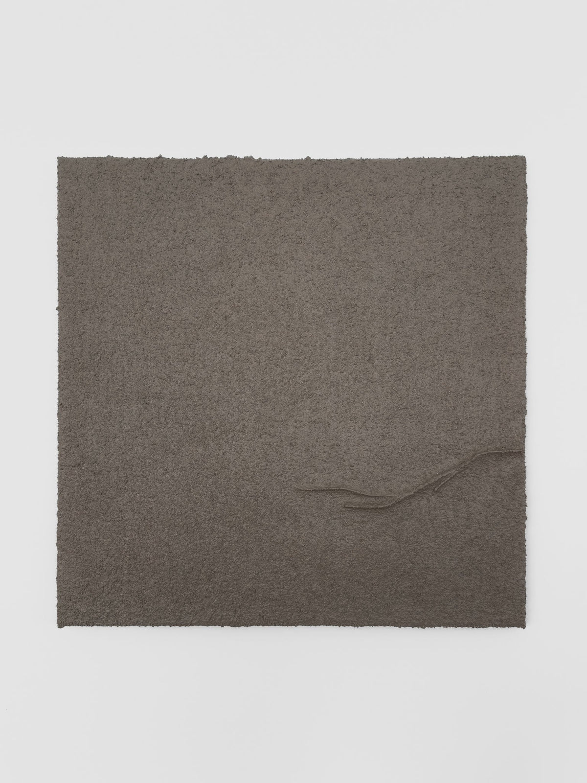 Shadow World 04 by Delal Salazar is a limited edition piece featuring acrylic and sand on canvas. The square dark brown artwork has rough edges and a raised, curving line from the lower right corner toward the center.