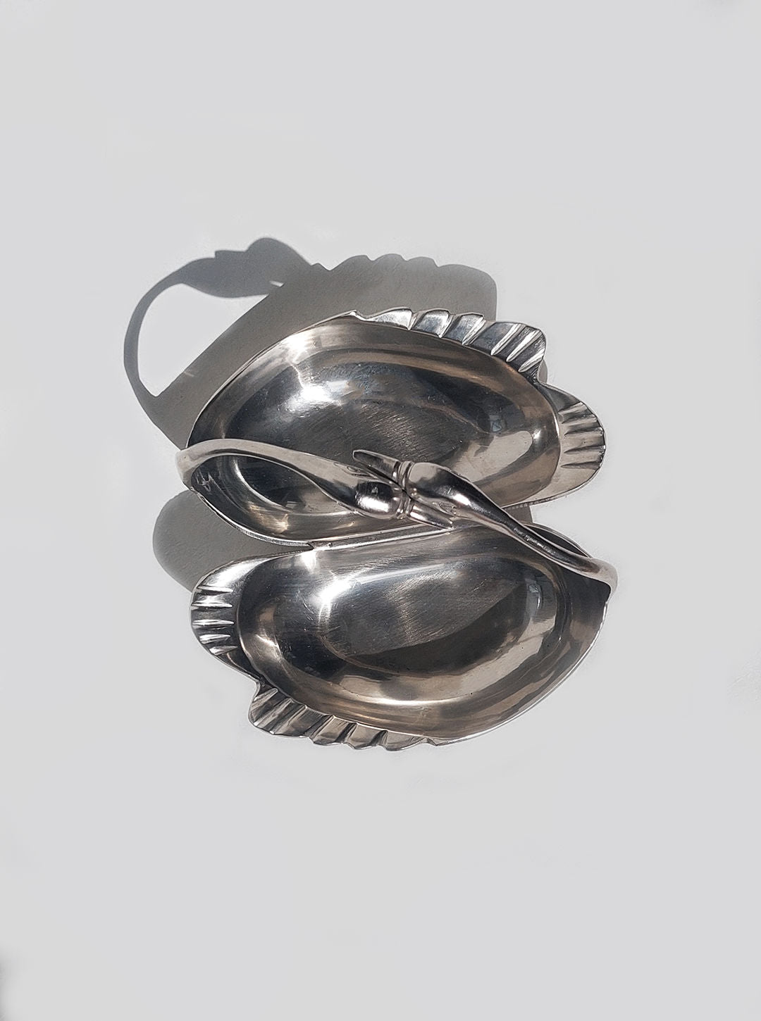 Decorative brass vide poche with a swan design