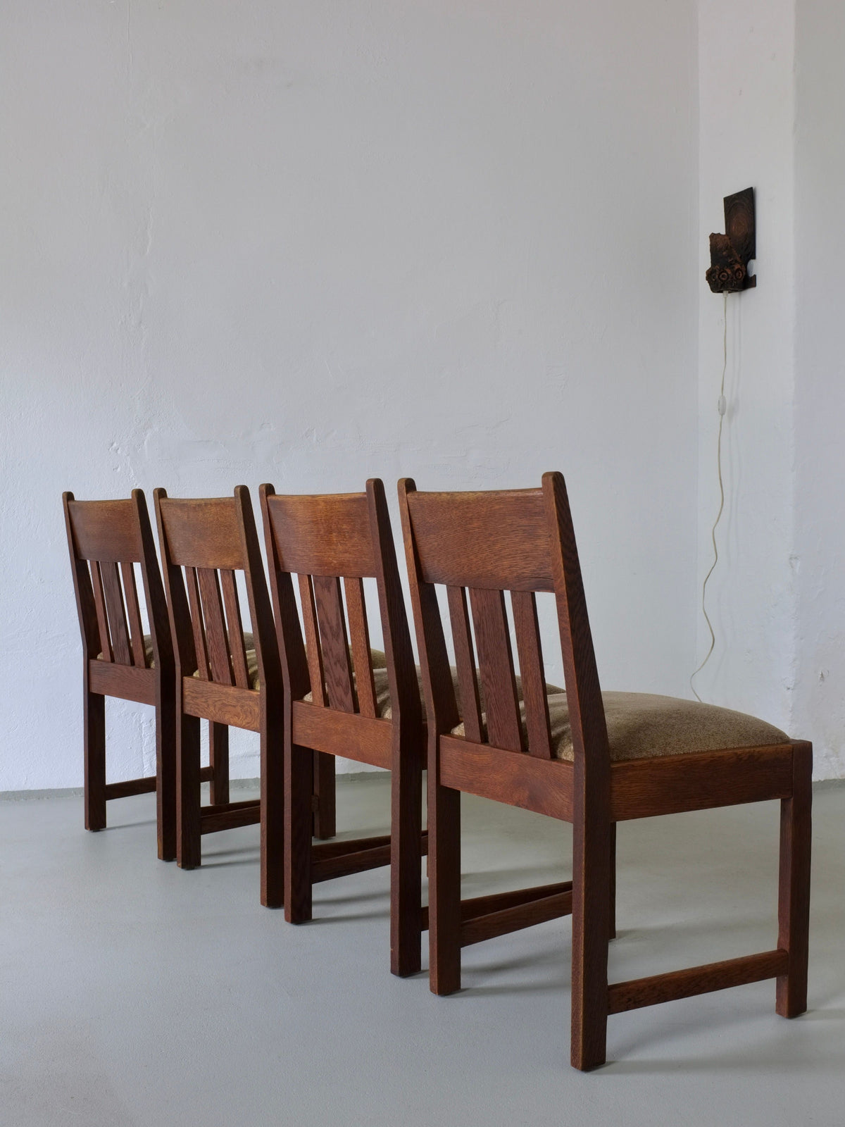 Set of four Arts & Crafts oak dining chairs with slat backs
