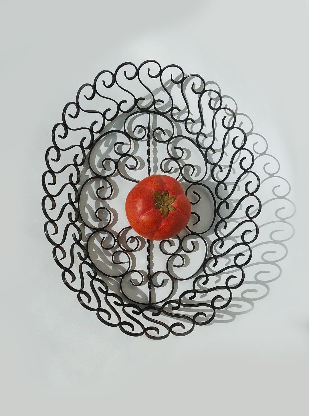 1950s wrought iron decorative basket with ornate scrollwork pattern