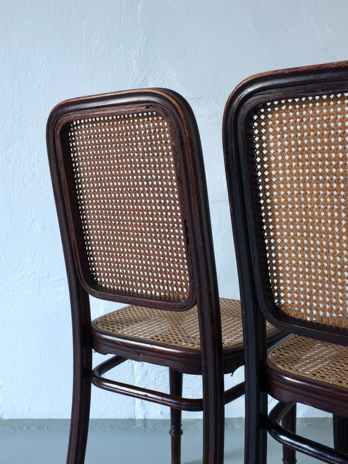 Close-up detail of Thonet bentwood chair backs with cane weaving