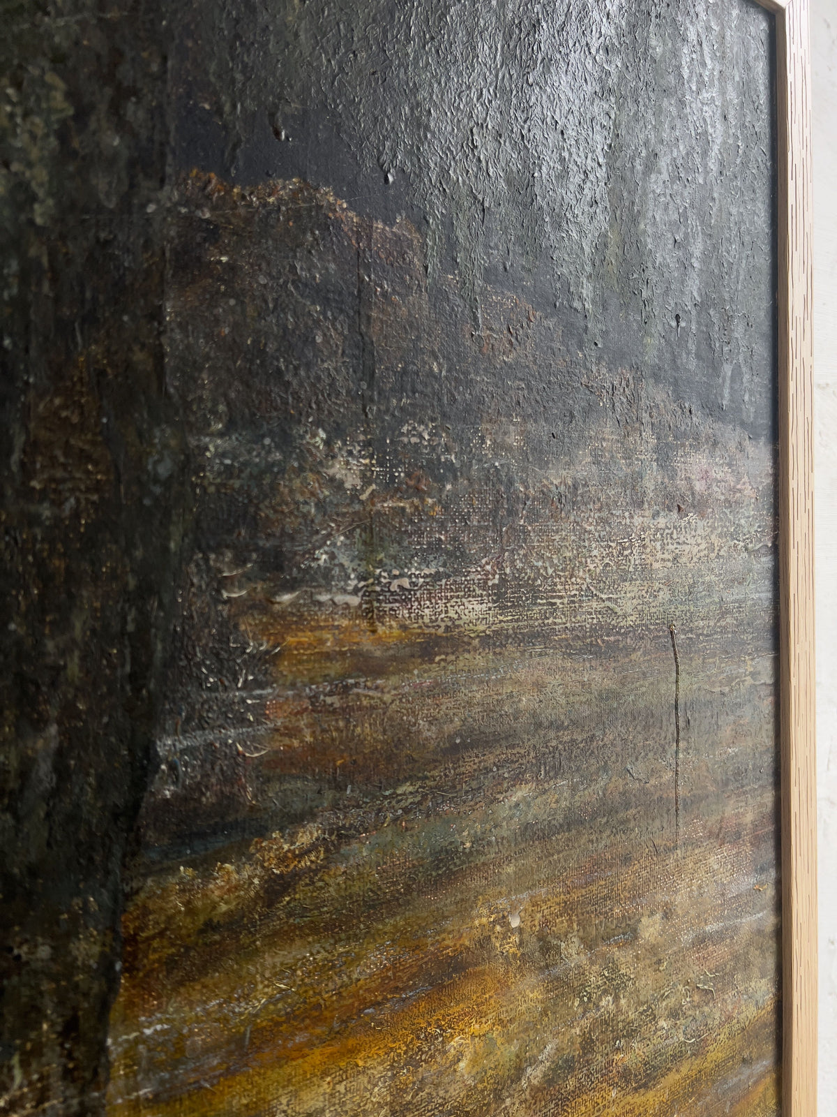 Close-up of Veter Vintage's "Vintage Landscape Painting, Oil on Canvas," showcasing dark shades and earthy tones. It features layered brown, black, and green colors in an abstract landscape with a rough texture, framed in light wood.