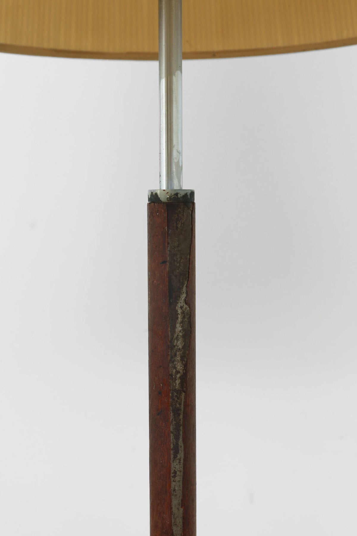 Weathered wood base detail of Scandi floor lamp with metal rod
