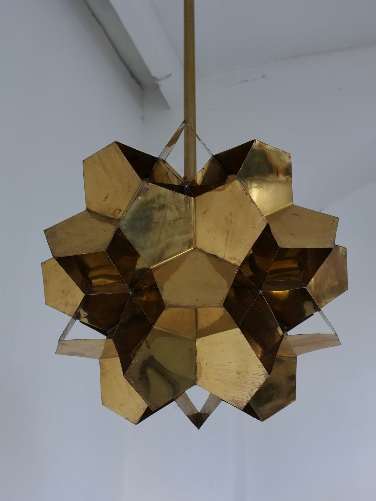The Veter Vintage Brutalist Brass Chandelier from Latvia's 70s era features geometric, gold-colored solid brass with hexagonal facets for sculptural, modern style. Compatible with E27 bulbs for versatile lighting.