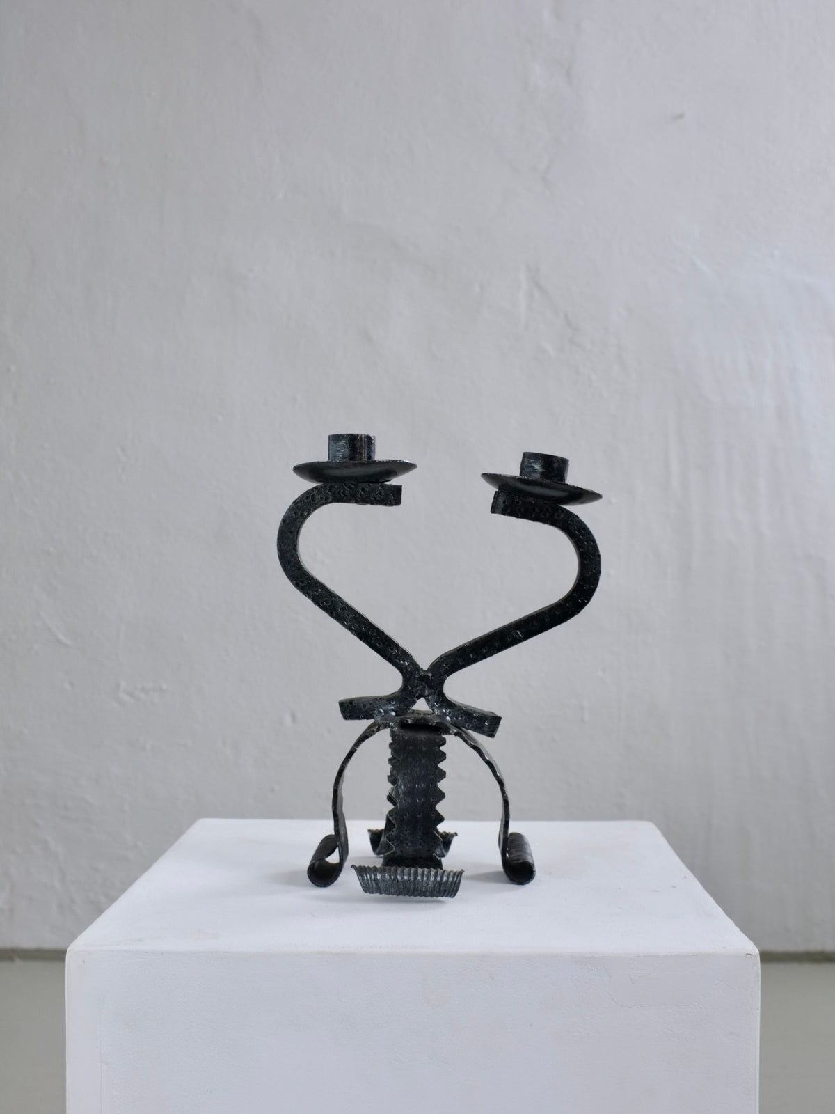 Brutalist iron candle holder with heart-shaped curved arms, 1970s