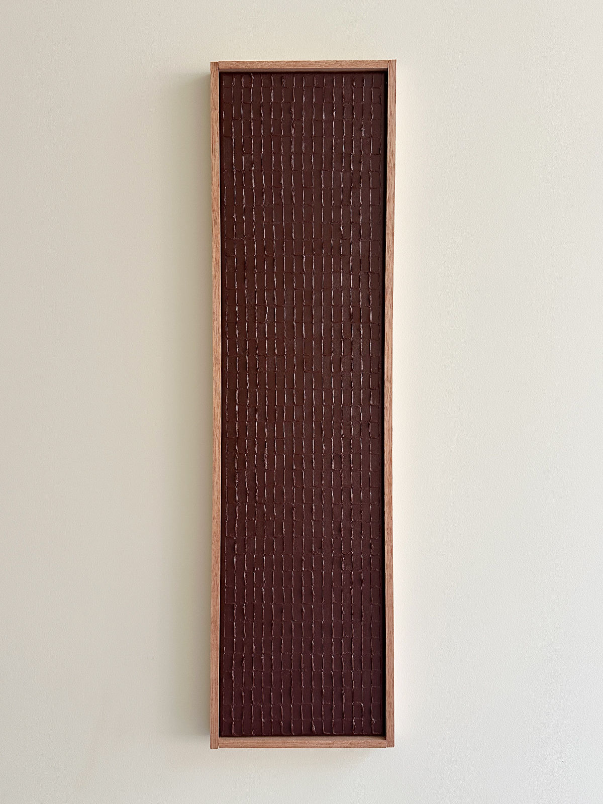 Abstract textured painting with vertical linear pattern in dark brown earth tones