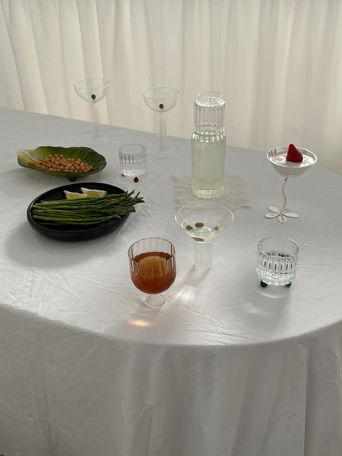 High Spirits — Lowball Glass Green — close-up on white table setting