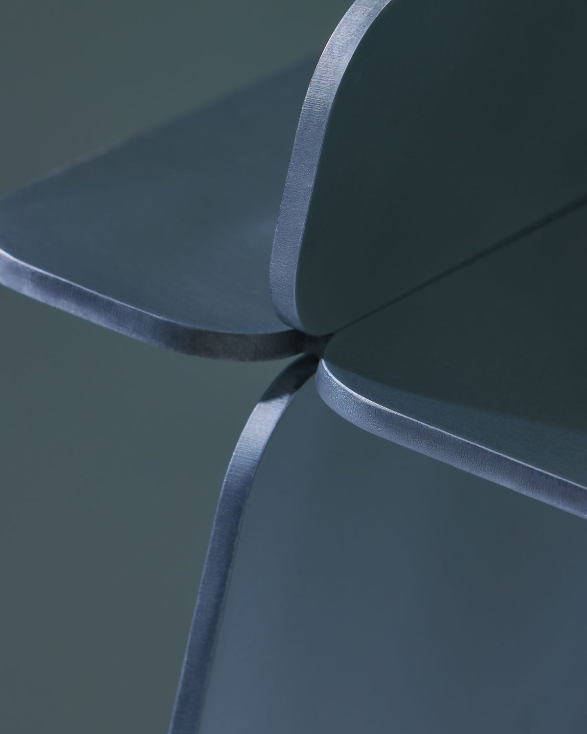 The Side Table — close-up of blue metal corner detail