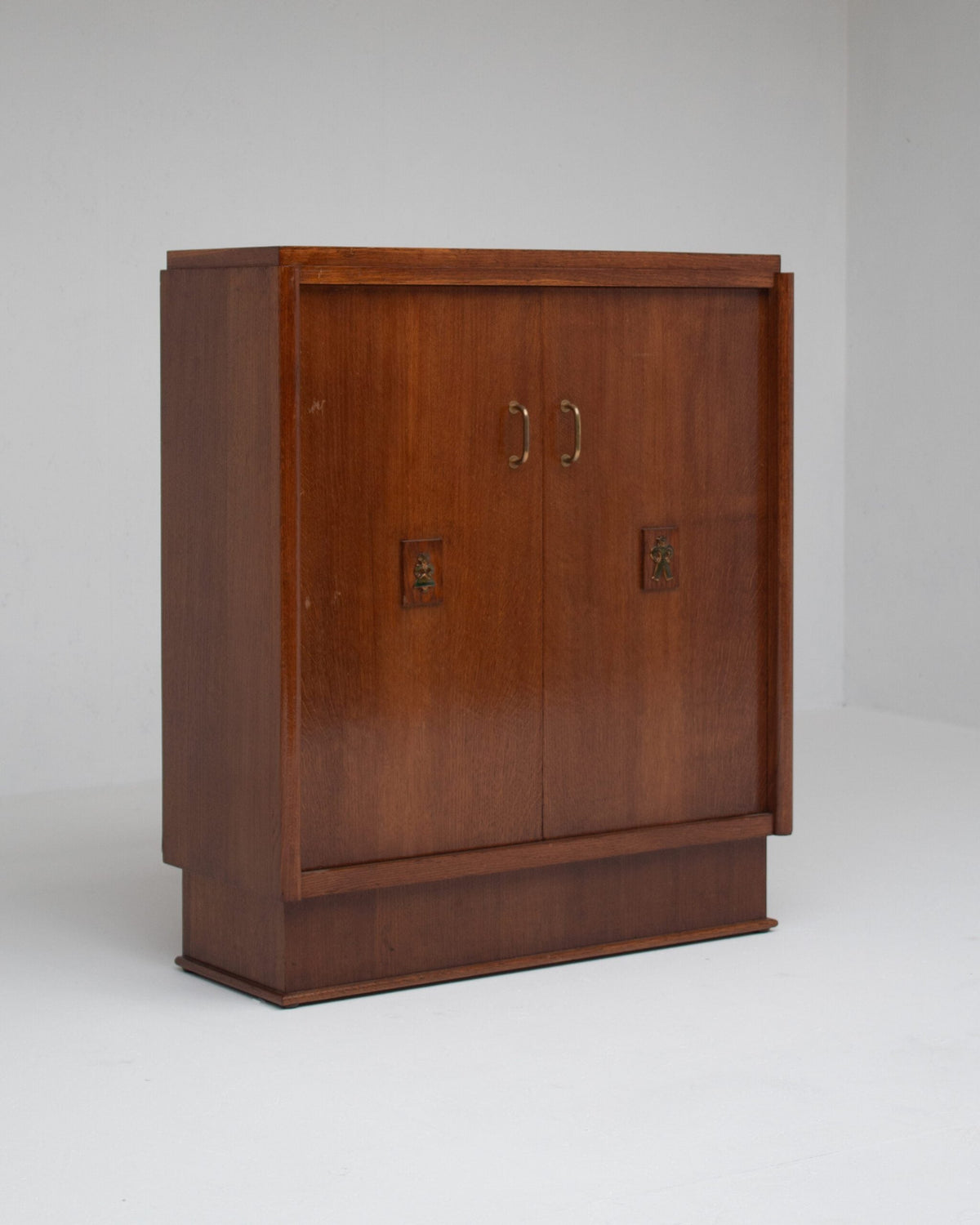 Mid-Century Oak Cabinet with Brass Handles and Decorative Inlays by Malata Antwerp | The Oblist