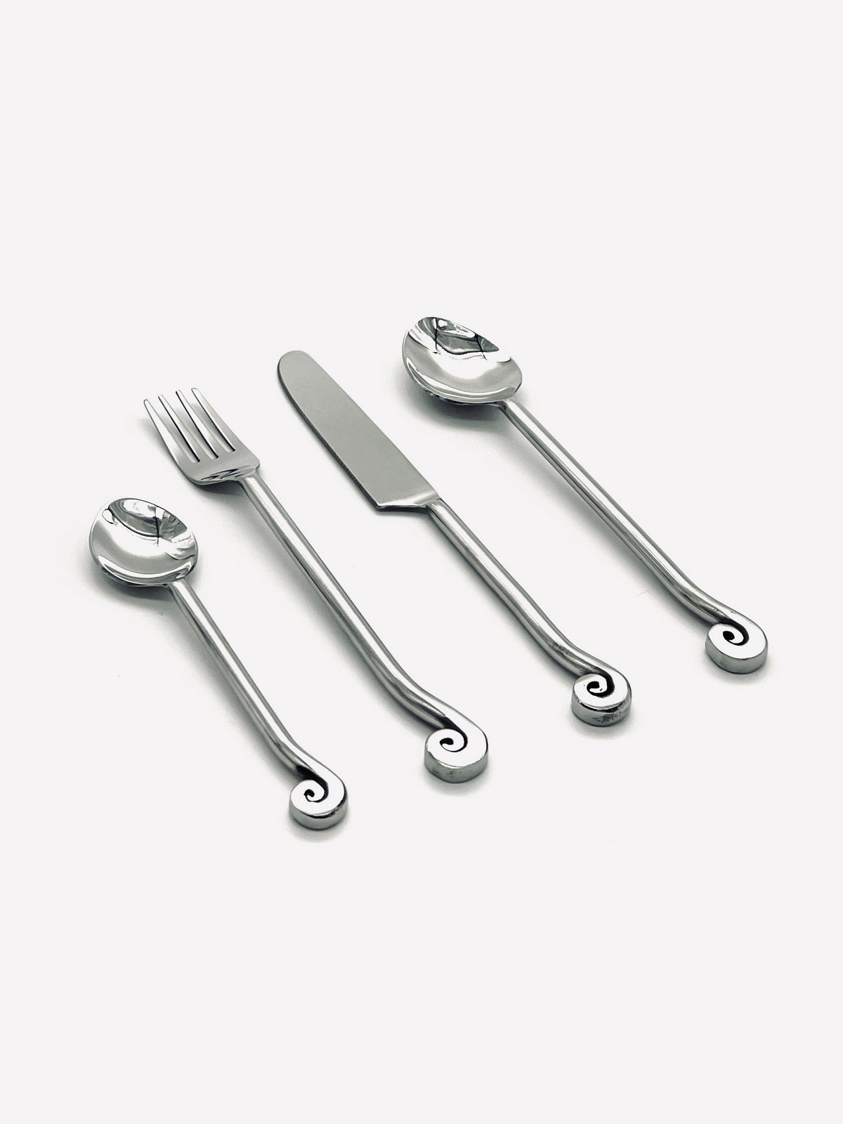 Four-piece vintage spiral cutlery set in polished stainless steel