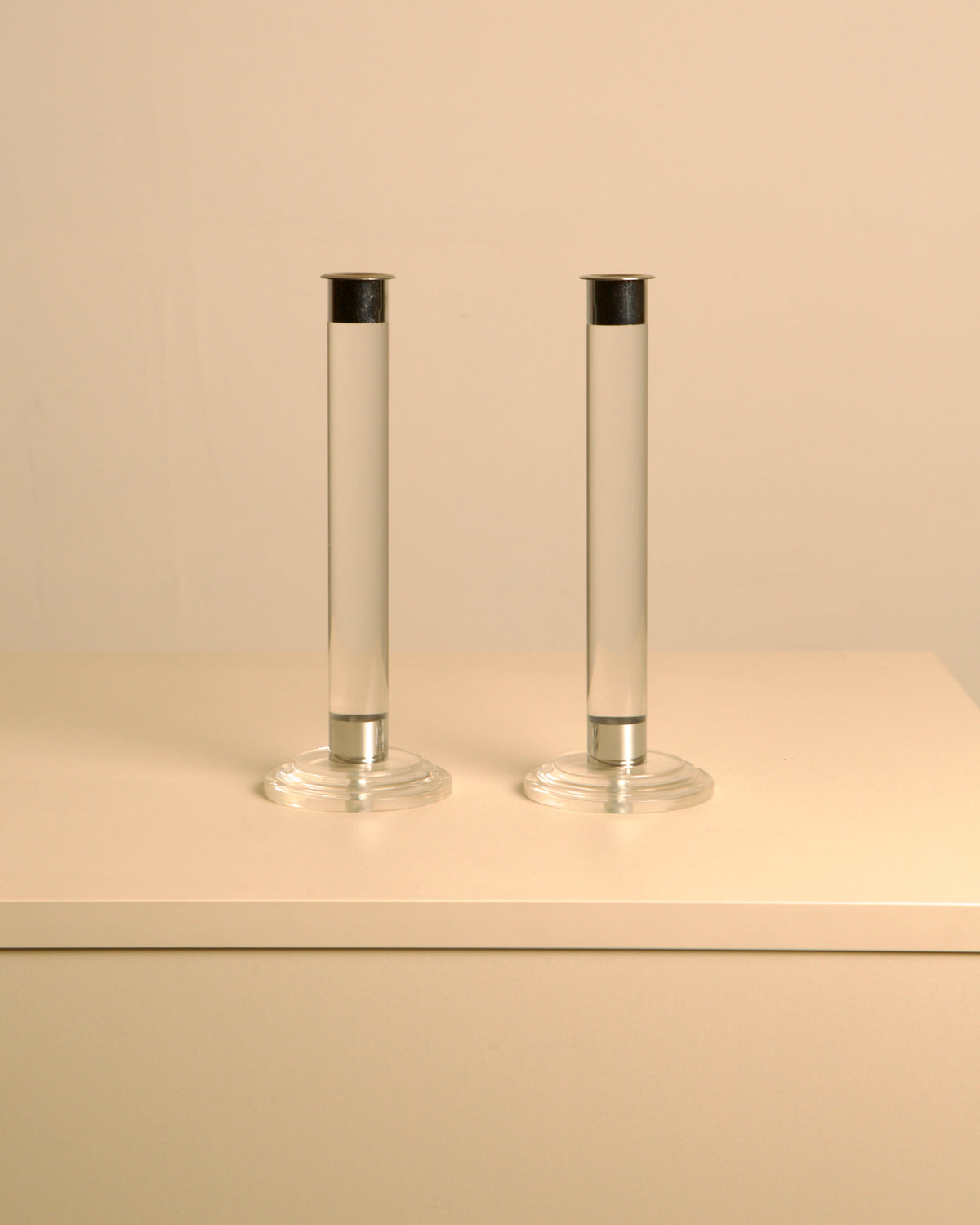 Pair of transparent Lucite candleholders with silver accents 1980s