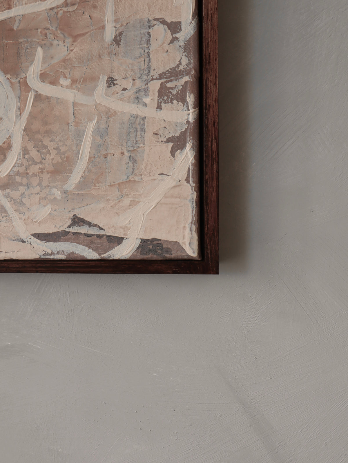 Abstract painting detail showing muted pink and beige brushstrokes