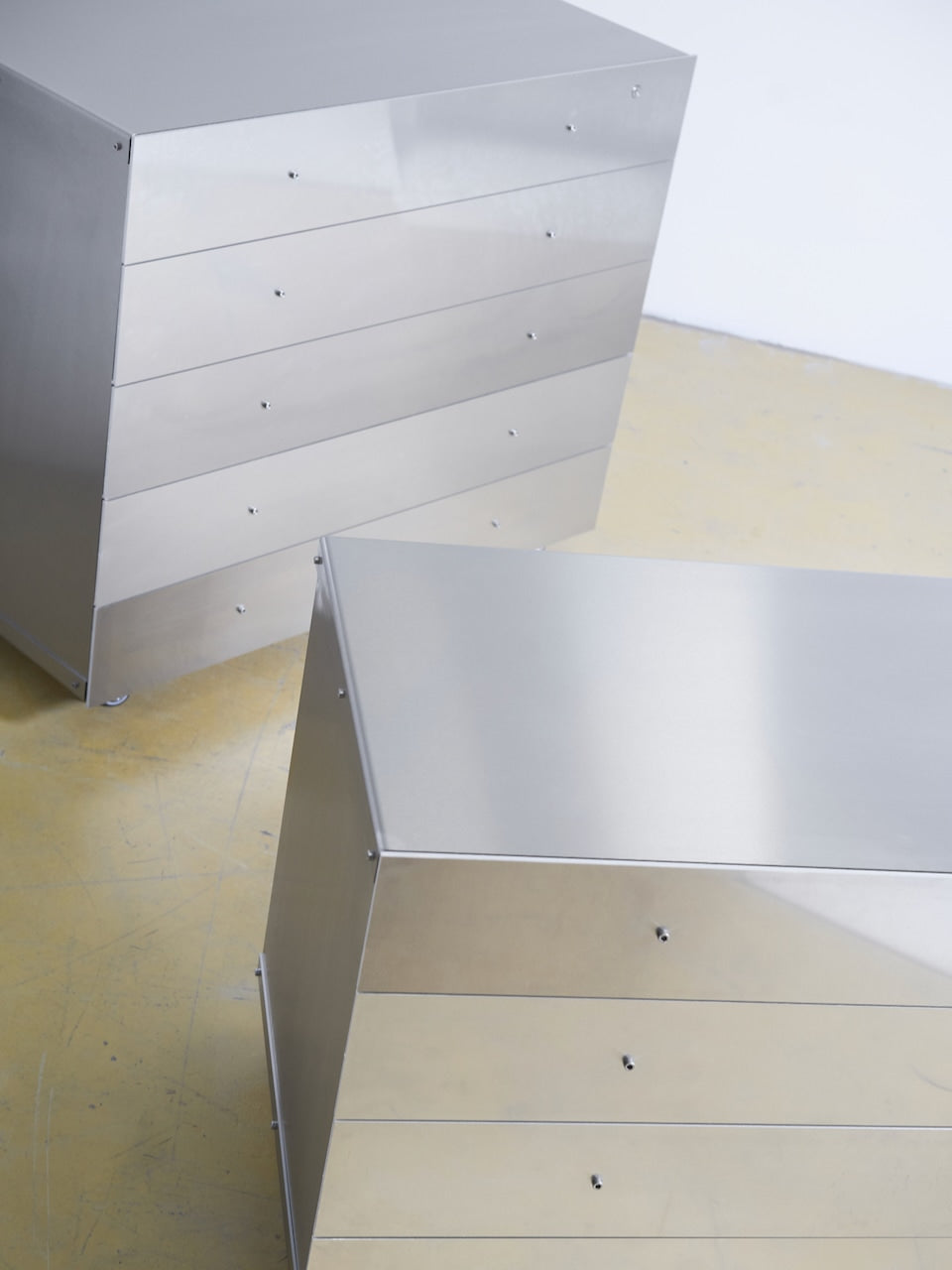 Chest of Drawers — angled view of polished metal surface