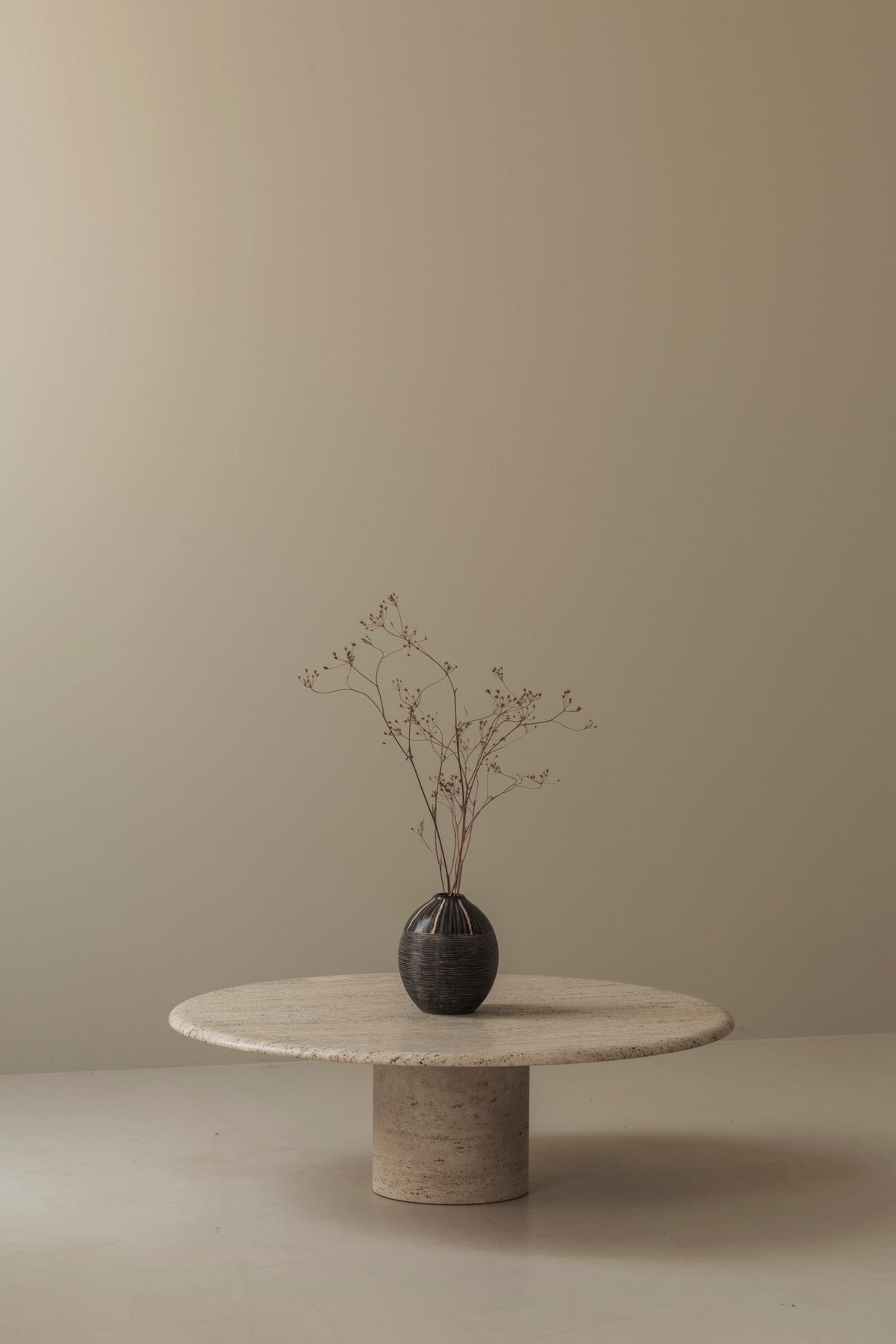 Travertine round coffee table by Angelo Mangiarotti, Italy 1970s — side angle